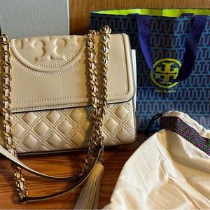 Tory Burch Fleming convertible bag, color is new cream.Used once.